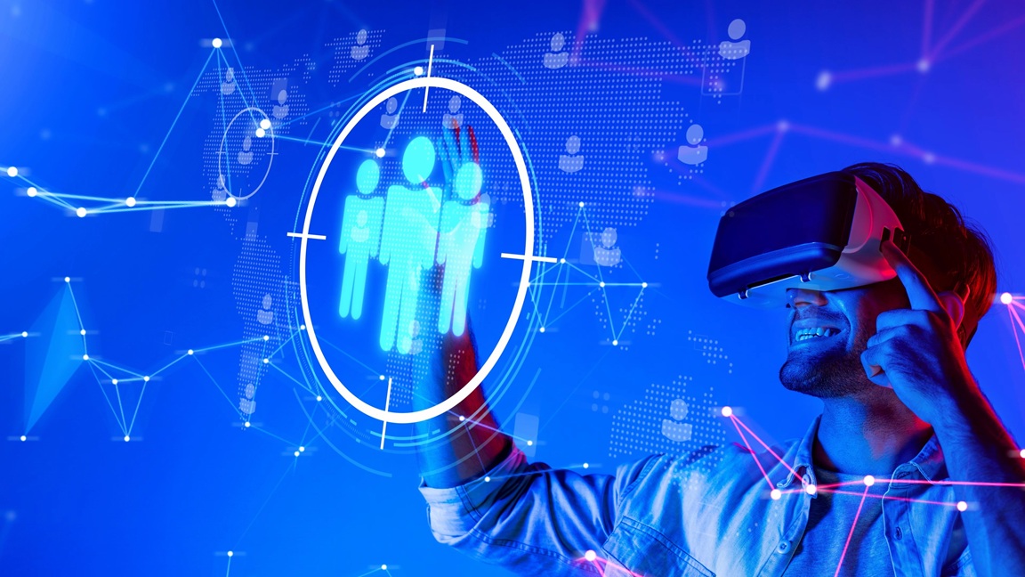 Person using a VR headset interacting with a digital interface showing connected people icons, representing technology, talent and recruitment at Syntelise